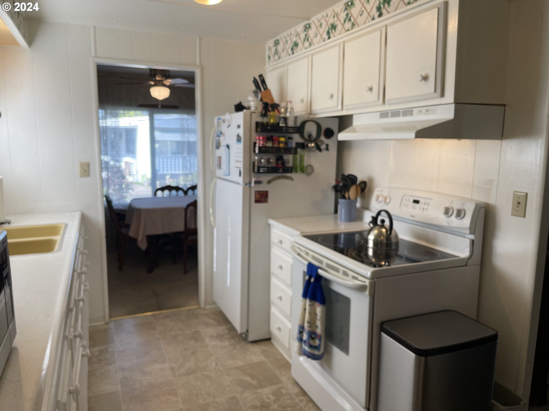 2150 Laura Street, Unit 31 Springfield, OR 97477 - Photo 8 of 19 a kitchen with refrigerator and cabinets