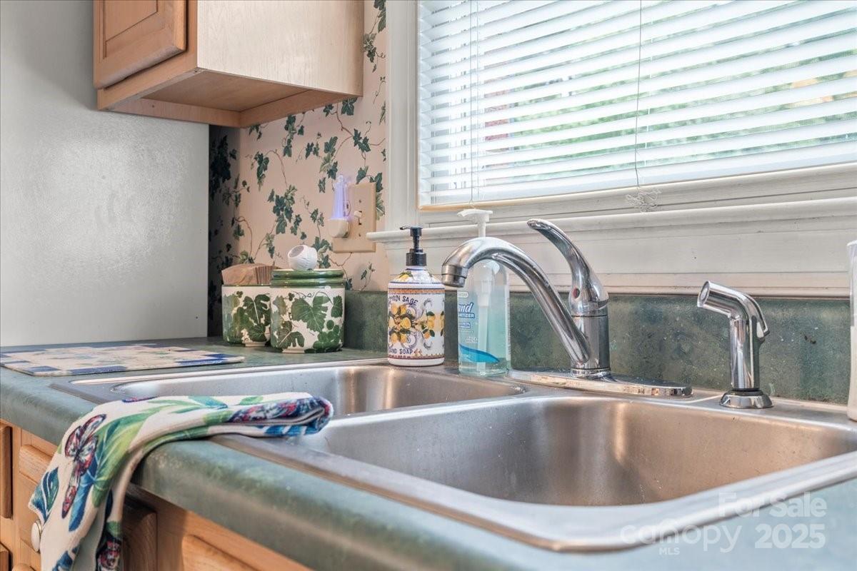 332 Ridge Road Cheraw, SC 29520 - Photo 17 of 46 a view of a kitchen sink table and chairs