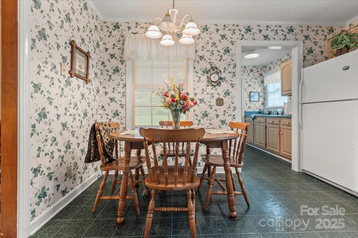 332 Ridge Road Cheraw, SC 29520 - Photo 19 of 46 a view of a dining room with furniture and chandelier