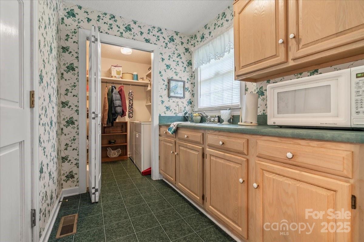 332 Ridge Road Cheraw, SC 29520 - Photo 20 of 46 a kitchen with cabinets and a refrigerator