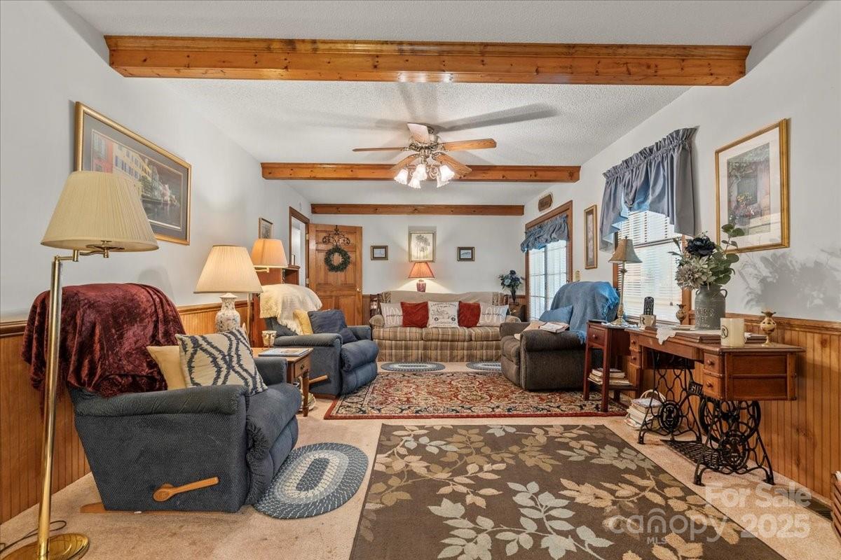 332 Ridge Road Cheraw, SC 29520 - Photo 23 of 46 a living room with furniture a chandelier and a rug