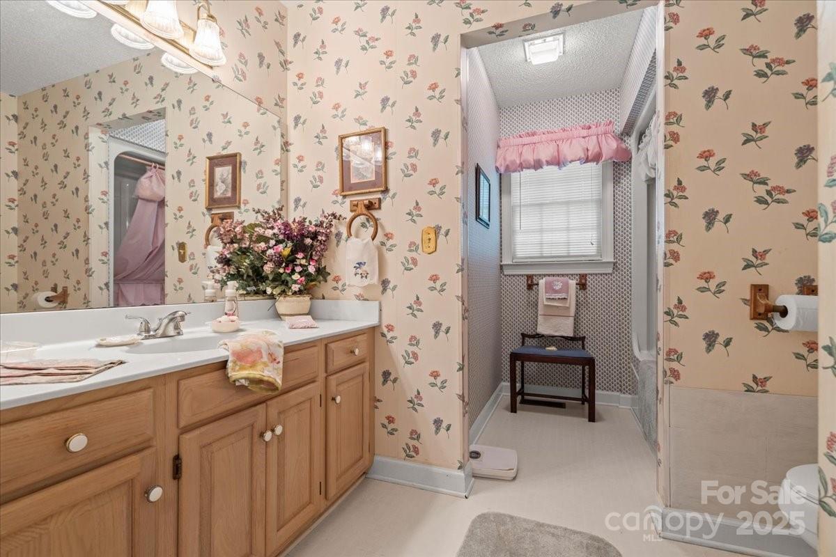 332 Ridge Road Cheraw, SC 29520 - Photo 28 of 46 a spacious bathroom with a sink and a mirror
