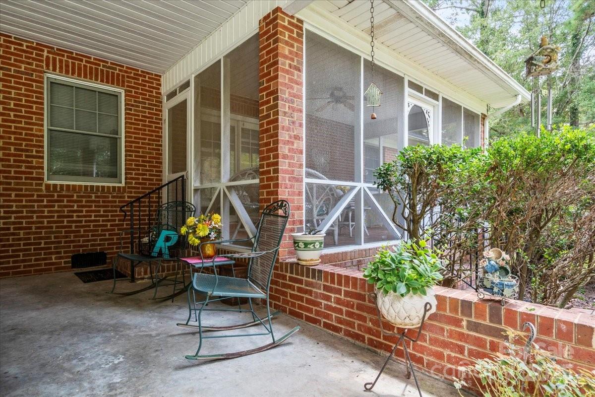 332 Ridge Road Cheraw, SC 29520 - Photo 38 of 46 a view of a chair and table in the back yard of the house
