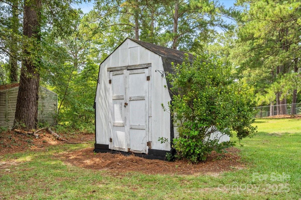 332 Ridge Road Cheraw, SC 29520 - Photo 40 of 46 a house with trees in front of it