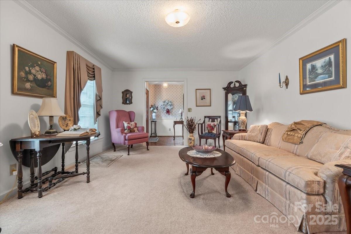 332 Ridge Road Cheraw, SC 29520 - Photo 9 of 46 a living room with furniture and a lamp