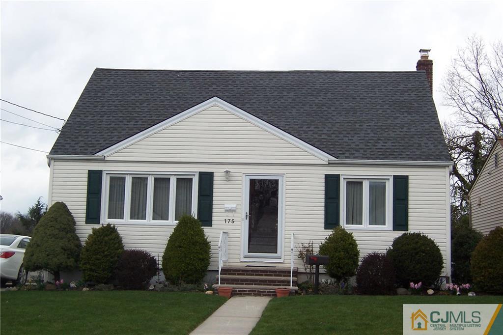 a view of a house with a yard and plants