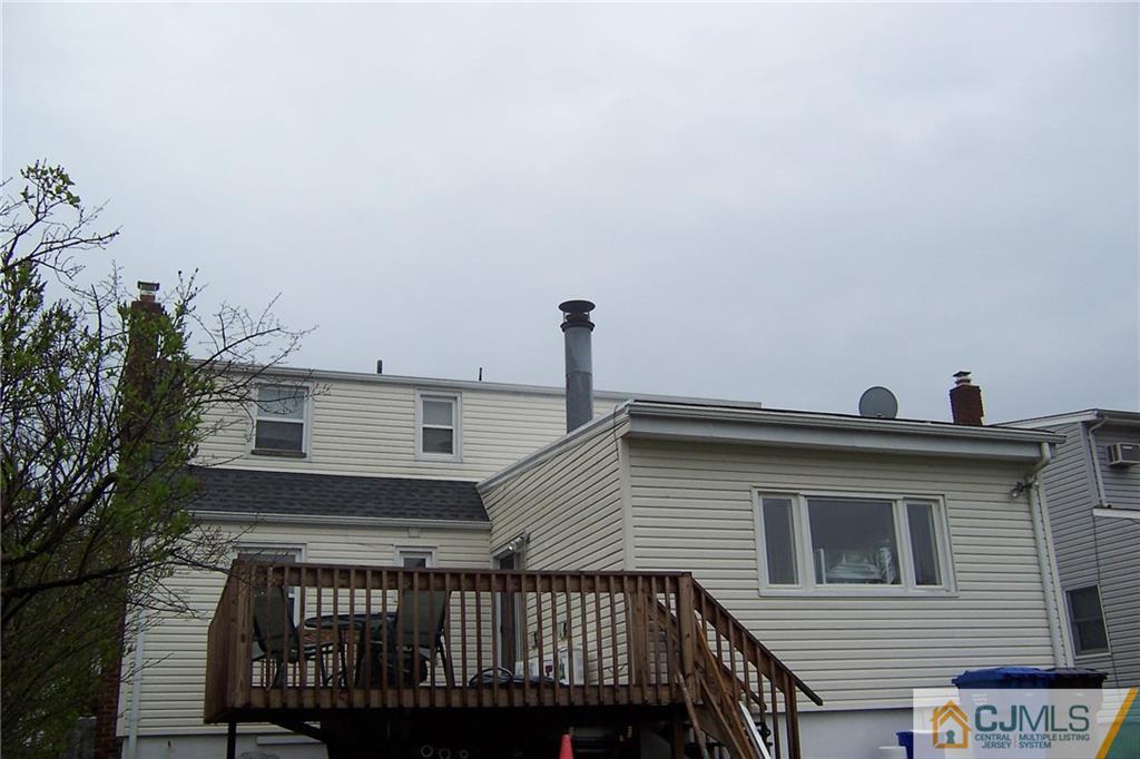 175 Midfield Road Colonia, NJ 07067 - Photo 2 of 25 a view of a house with a roof deck