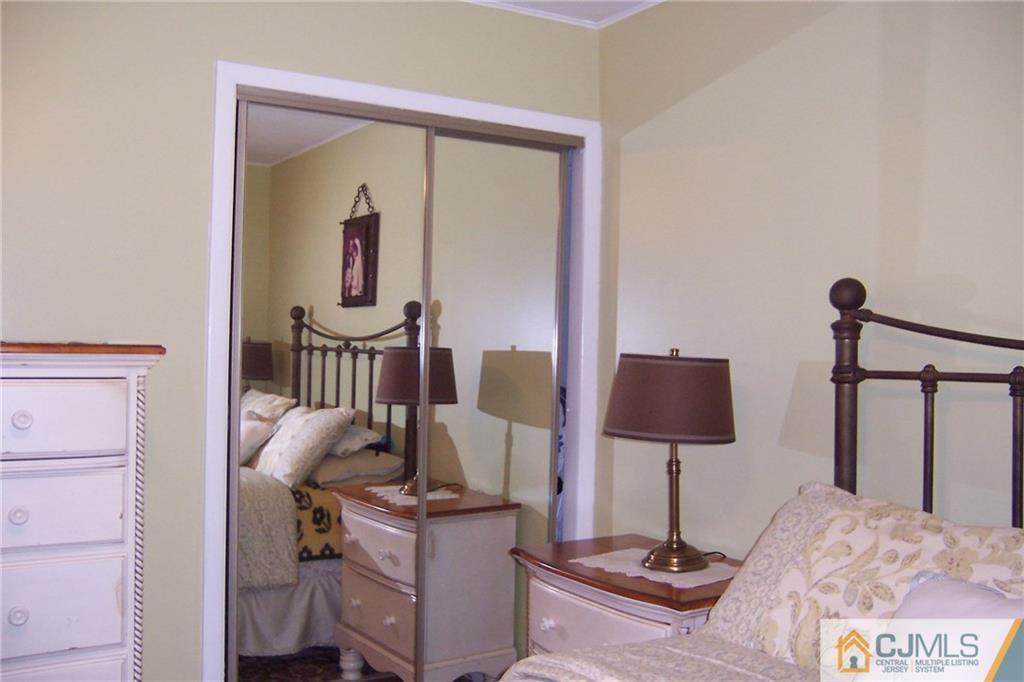 175 Midfield Road Colonia, NJ 07067 - Photo 14 of 25 a view of hall way with furniture and rug
