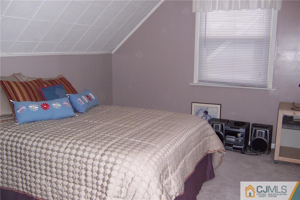 175 Midfield Road Colonia, NJ 07067 - Photo 17 of 25 a bedroom with a bed and a window