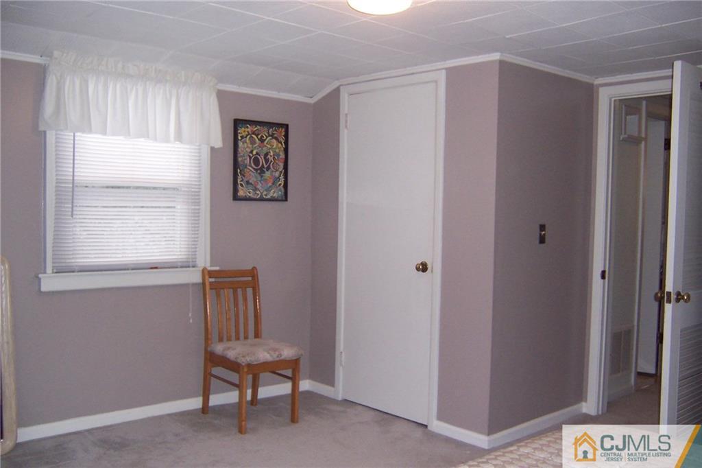 175 Midfield Road Colonia, NJ 07067 - Photo 18 of 25 a view of room with window and lounge chair