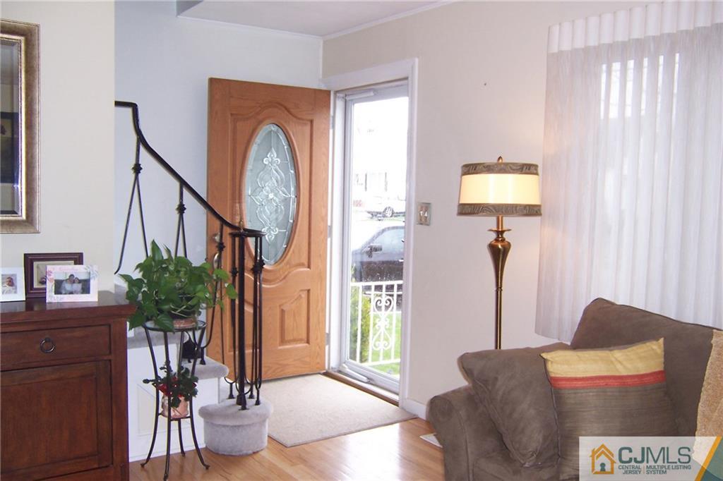 175 Midfield Road Colonia, NJ 07067 - Photo 3 of 25 a living room with furniture and a window