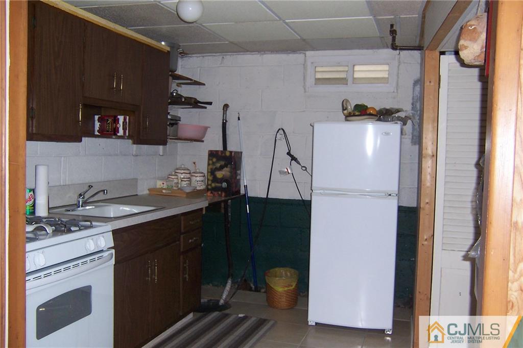 175 Midfield Road Colonia, NJ 07067 - Photo 21 of 25 a kitchen with a sink and cabinets