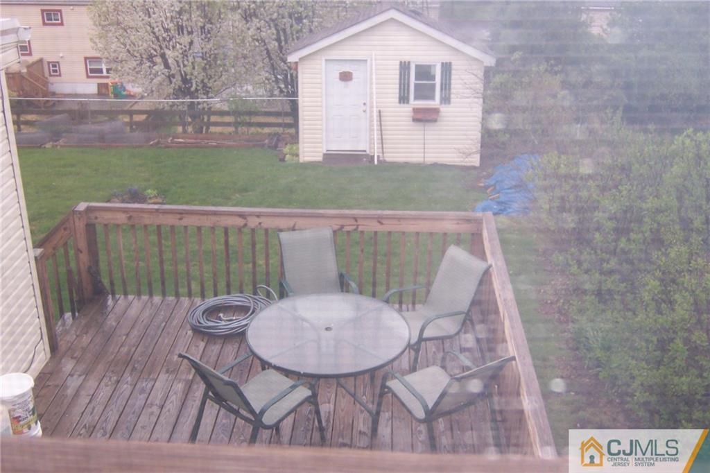 175 Midfield Road Colonia, NJ 07067 - Photo 24 of 25 a view of a chair and table in backyard