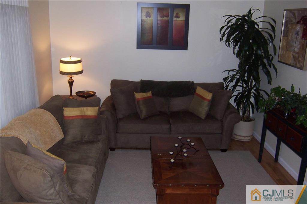 175 Midfield Road Colonia, NJ 07067 - Photo 4 of 25 a living room with furniture and a potted plant