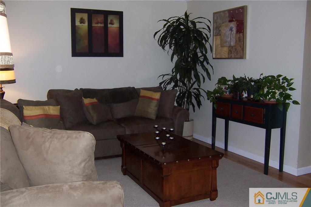 175 Midfield Road Colonia, NJ 07067 - Photo 5 of 25 a living room with furniture and a potted plant
