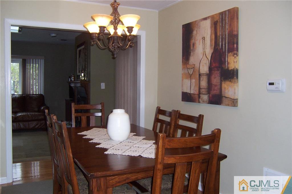 175 Midfield Road Colonia, NJ 07067 - Photo 9 of 25 a view of a dining room with furniture and wooden floor