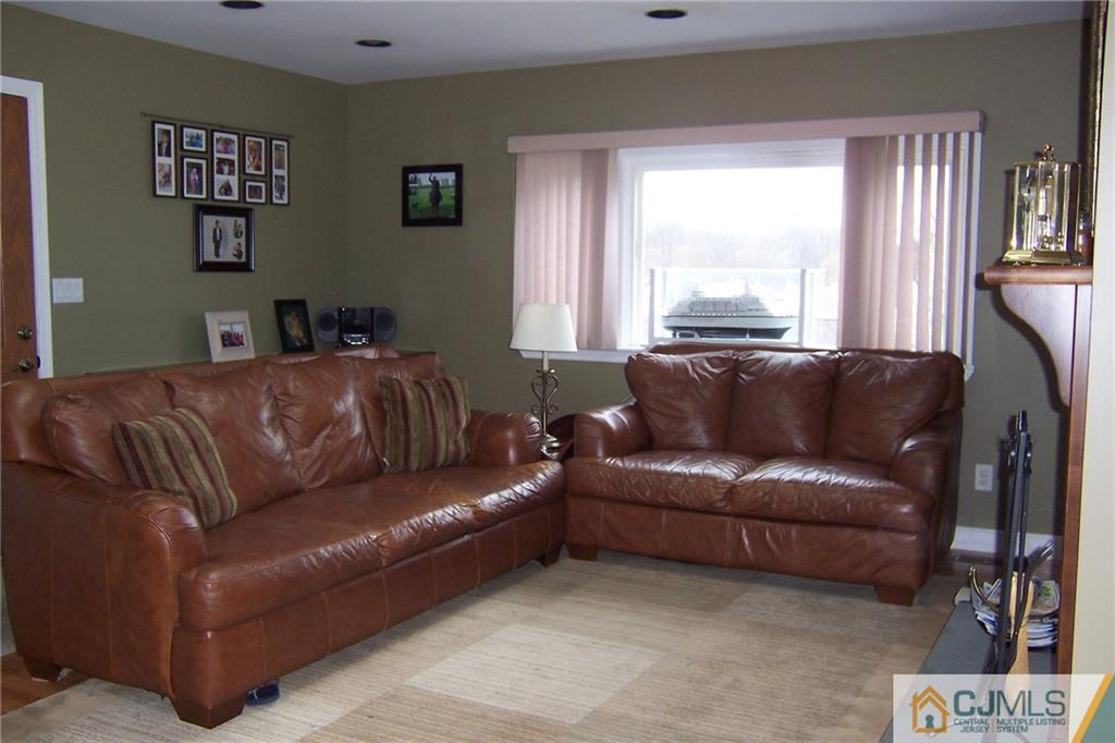 175 Midfield Road Colonia, NJ 07067 - Photo 10 of 25 a living room with a couch and a window
