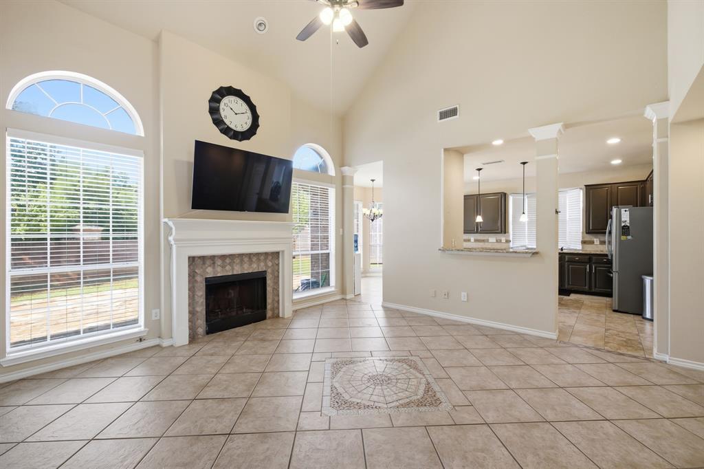 1911 New Haven Road Grapevine, TX 76051 - Photo 19 of 39 2-story great room in the center of the back of the house is the true hub of the home.