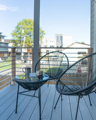 a view of balcony with furniture