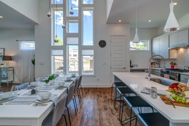 a kitchen with granite countertop lots of counter top space and dining table