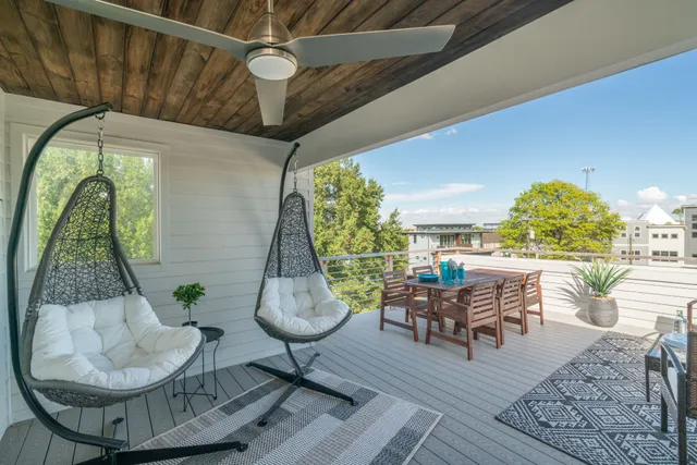 a living room with furniture a table and chairs