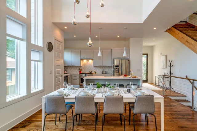a view of a dining room with furniture and wooden floor