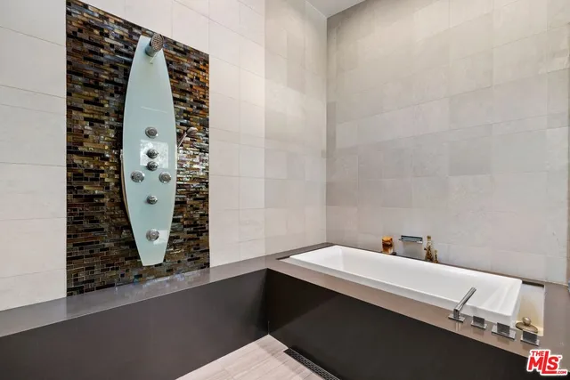 a living room with furniture large window and table