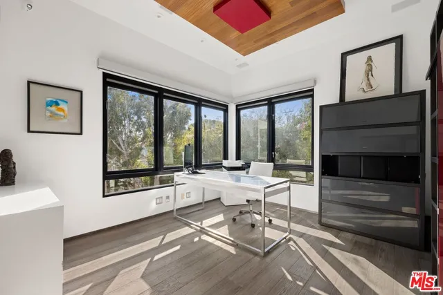 a bedroom with a bed a couch and dresser