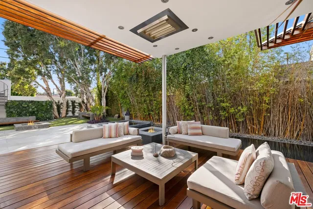 a view of a house with backyard porch and sitting area