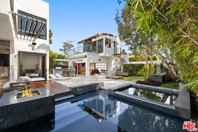 a view of a patio with table and chairs potted plants with bedroom view