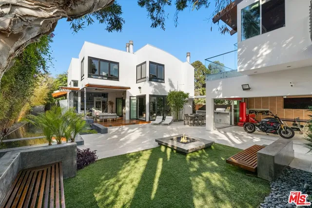 a view of a patio with swimming pool table and chairs