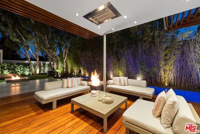 a view of living room with furniture and a fireplace