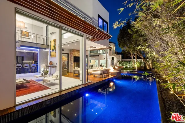 a view of swimming pool with outdoor seating