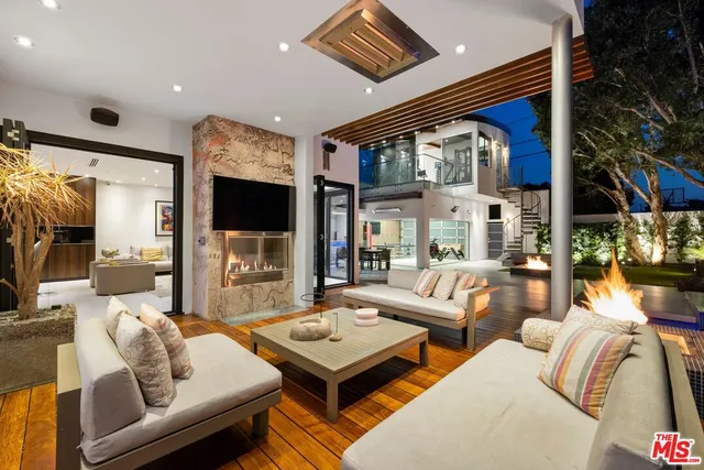a living room with furniture fireplace and a flat screen tv