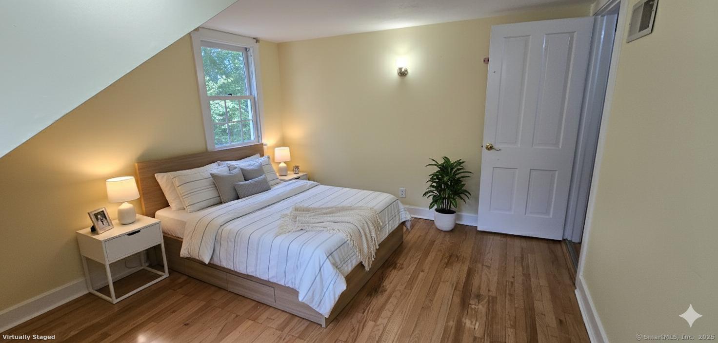 187 West Avon Road Avon, CT 06001 - Photo 11 of 40 a bedroom with a bed and a window
