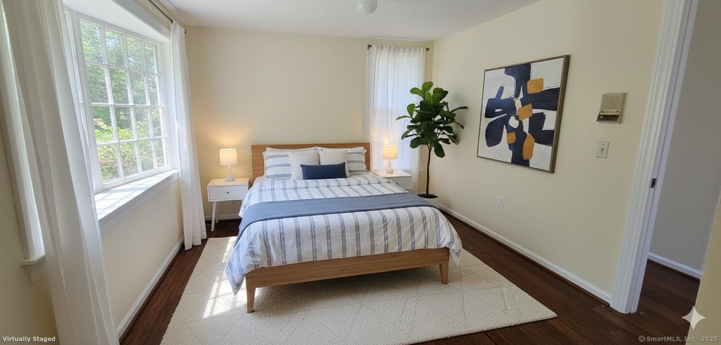 187 West Avon Road Avon, CT 06001 - Photo 13 of 40 a bedroom with a bed and a potted plant