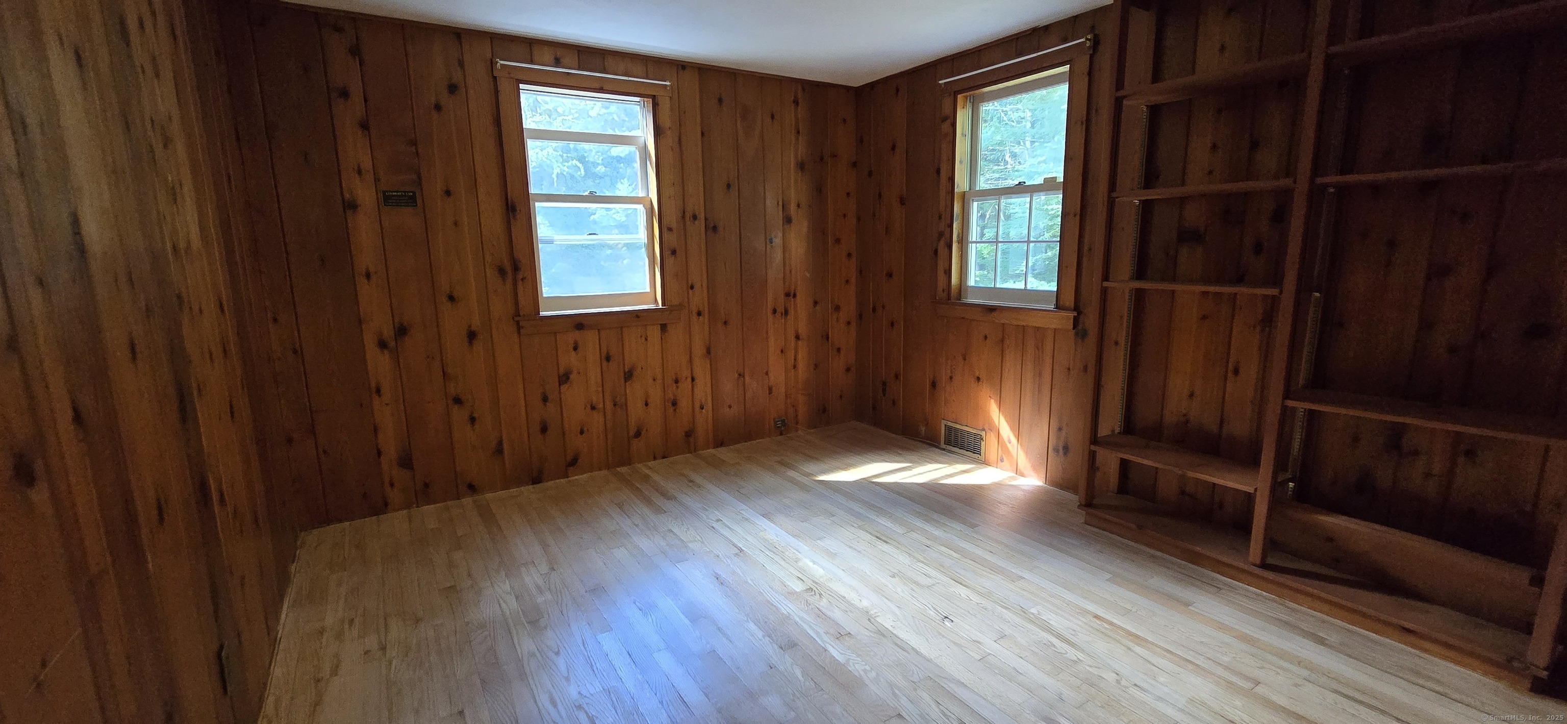 187 West Avon Road Avon, CT 06001 - Photo 17 of 40 a view of an empty room with wooden floor and windows
