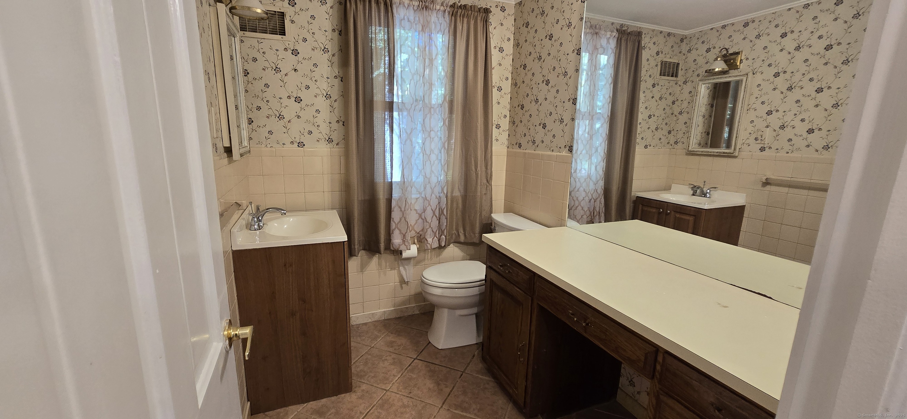 187 West Avon Road Avon, CT 06001 - Photo 19 of 40 a bathroom with a sink a toilet and shower