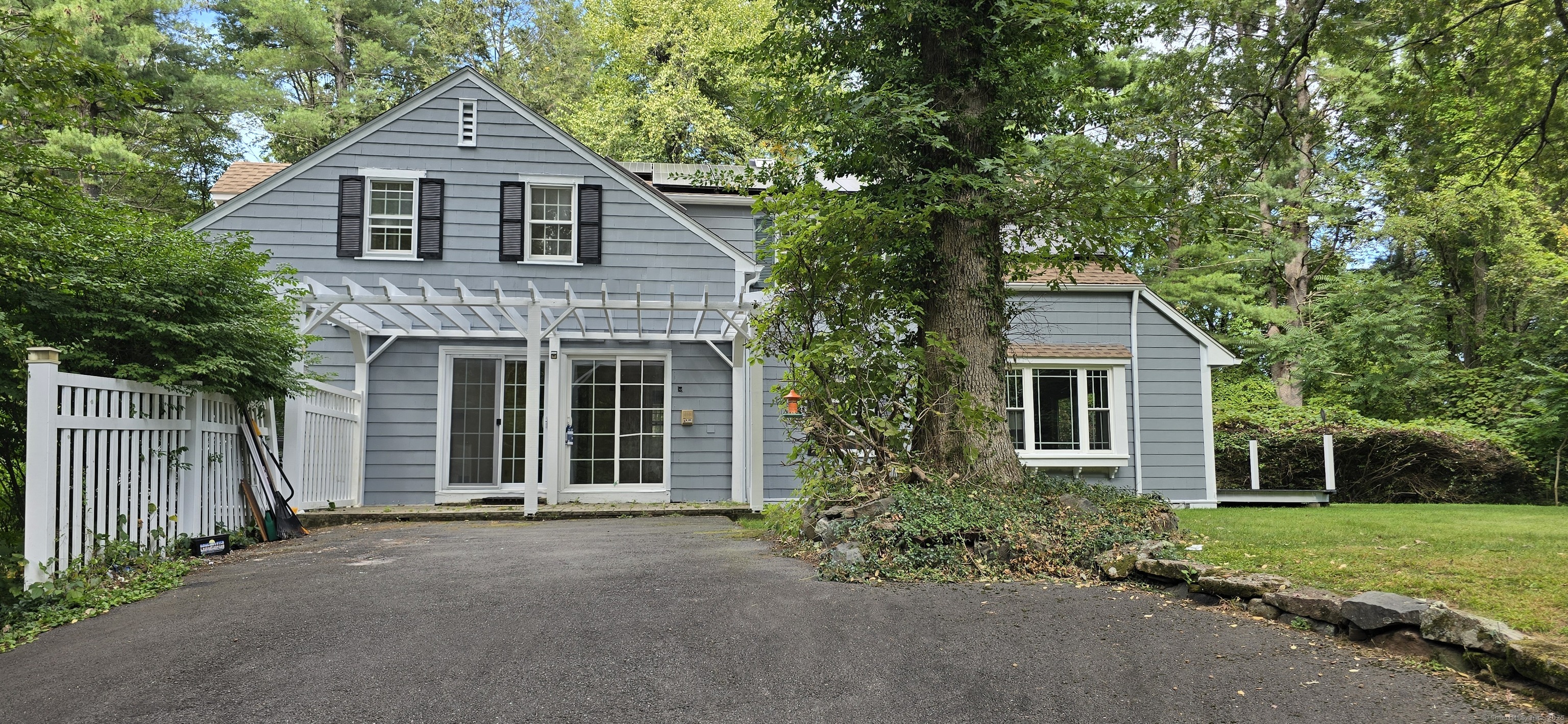 187 West Avon Road Avon, CT 06001 - Photo 20 of 40 a front view of a house with a yard
