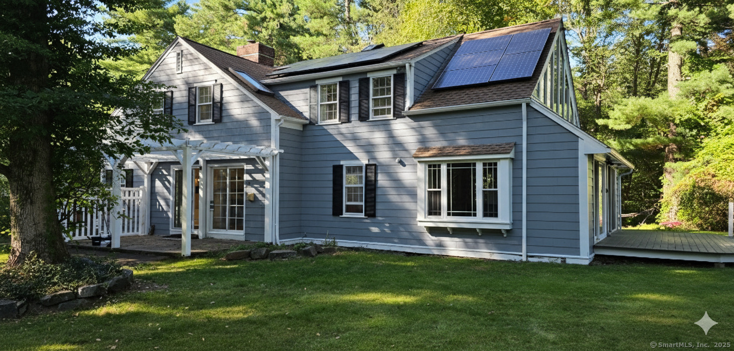 187 West Avon Road Avon, CT 06001 - Photo 22 of 40 front view of a house with a yard