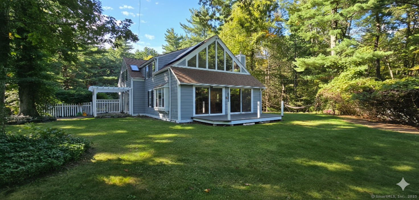 187 West Avon Road Avon, CT 06001 - Photo 24 of 40 a view of a house with a yard potted plants and large tree