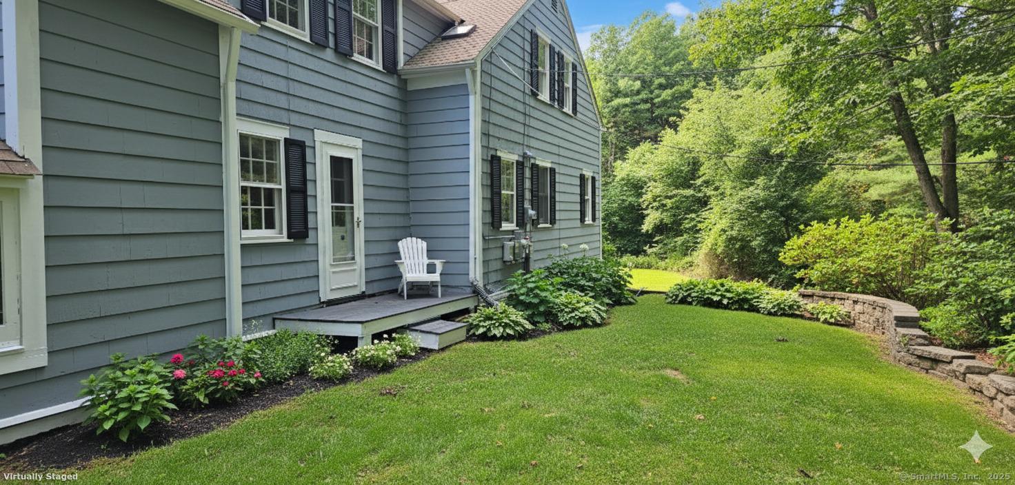 187 West Avon Road Avon, CT 06001 - Photo 27 of 40 a view of a chair and table in the garden