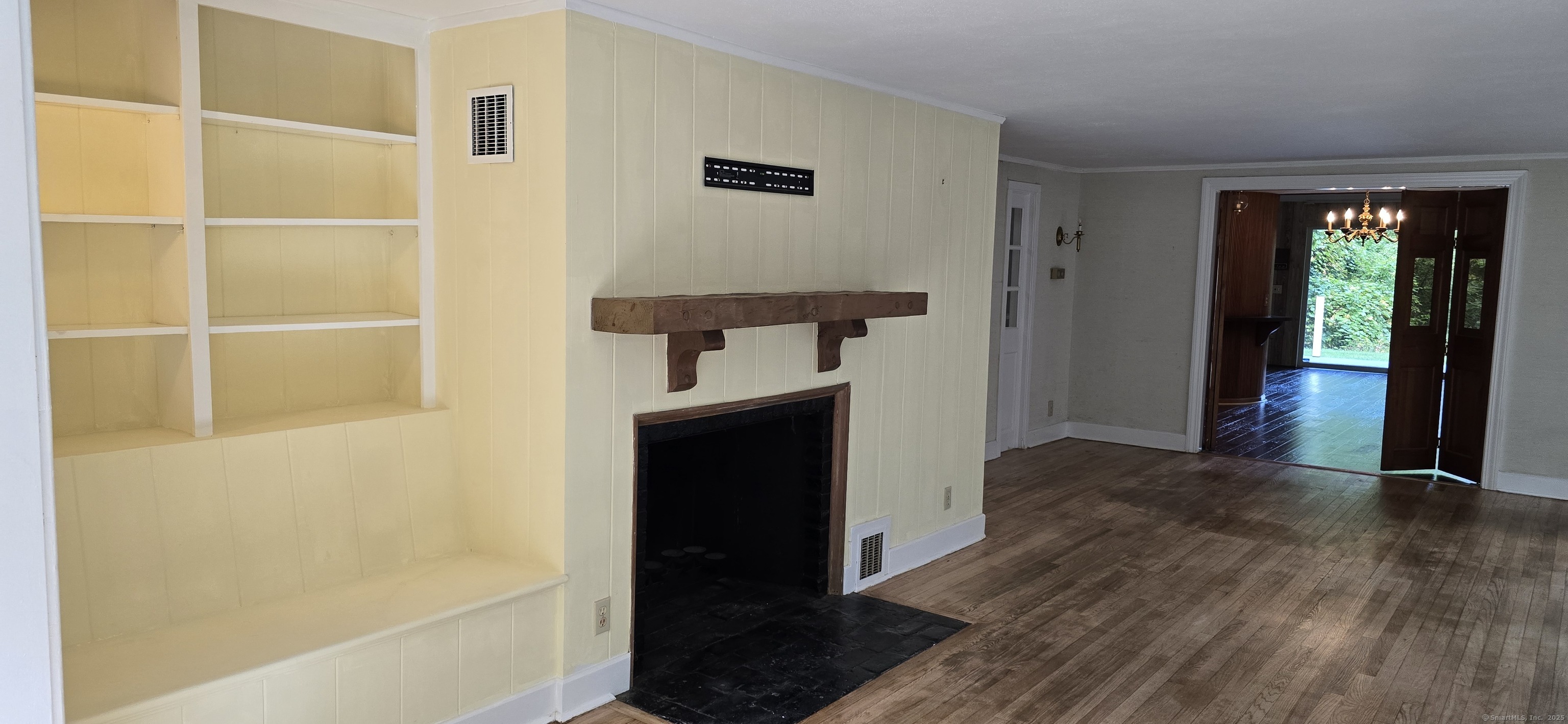 187 West Avon Road Avon, CT 06001 - Photo 3 of 40 a view of a hallway with wooden floor and staircase