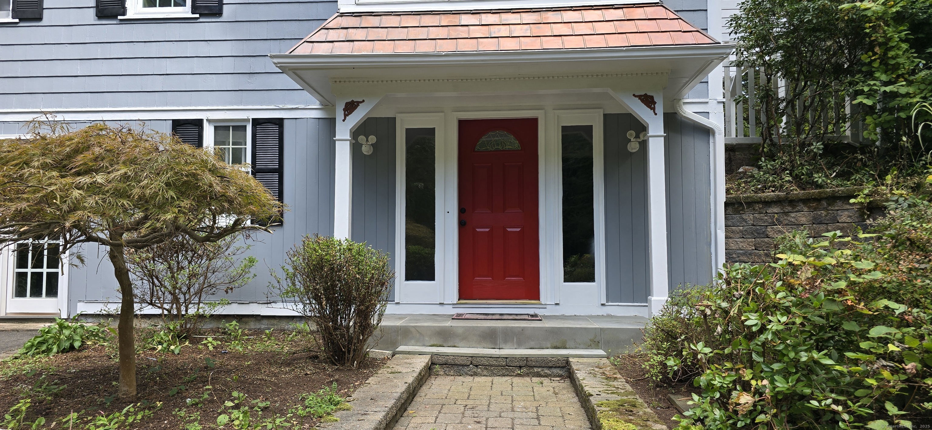 187 West Avon Road Avon, CT 06001 - Photo 34 of 40 a front view of a house with garden
