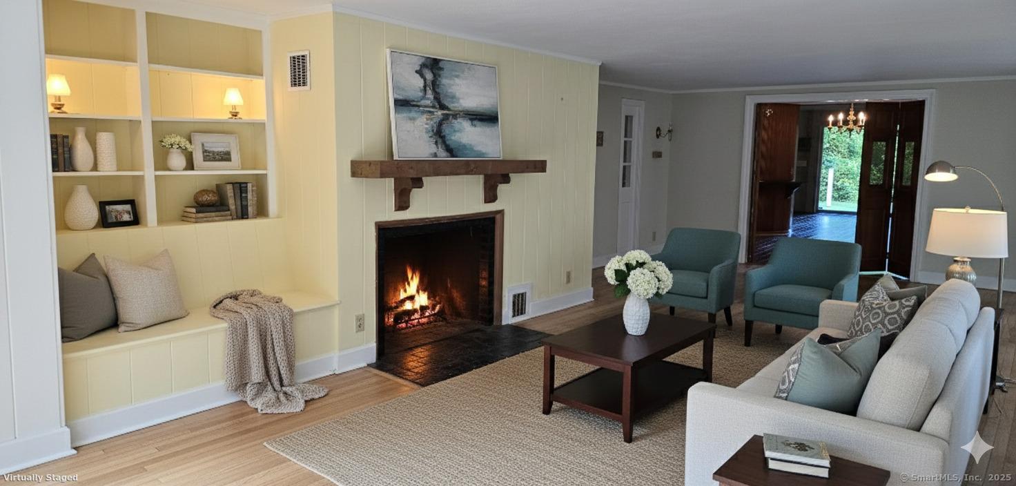 187 West Avon Road Avon, CT 06001 - Photo 4 of 40 a living room with furniture and a fireplace