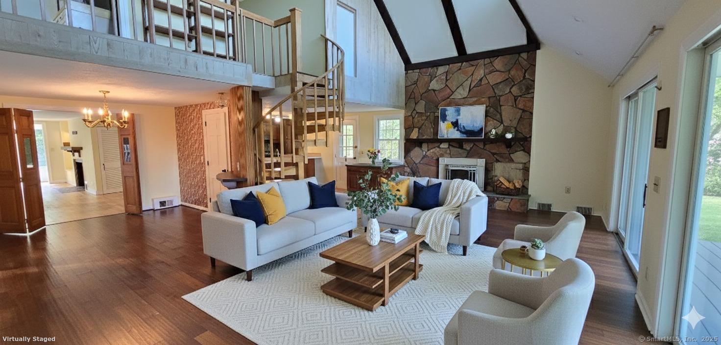 187 West Avon Road Avon, CT 06001 - Photo 6 of 40 a living room with furniture and a fireplace