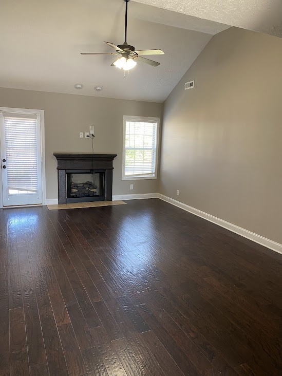 1621 Apache Way Clarksville, TN 37042 - Photo 3 of 13 an empty room with wooden floor fireplace and windows