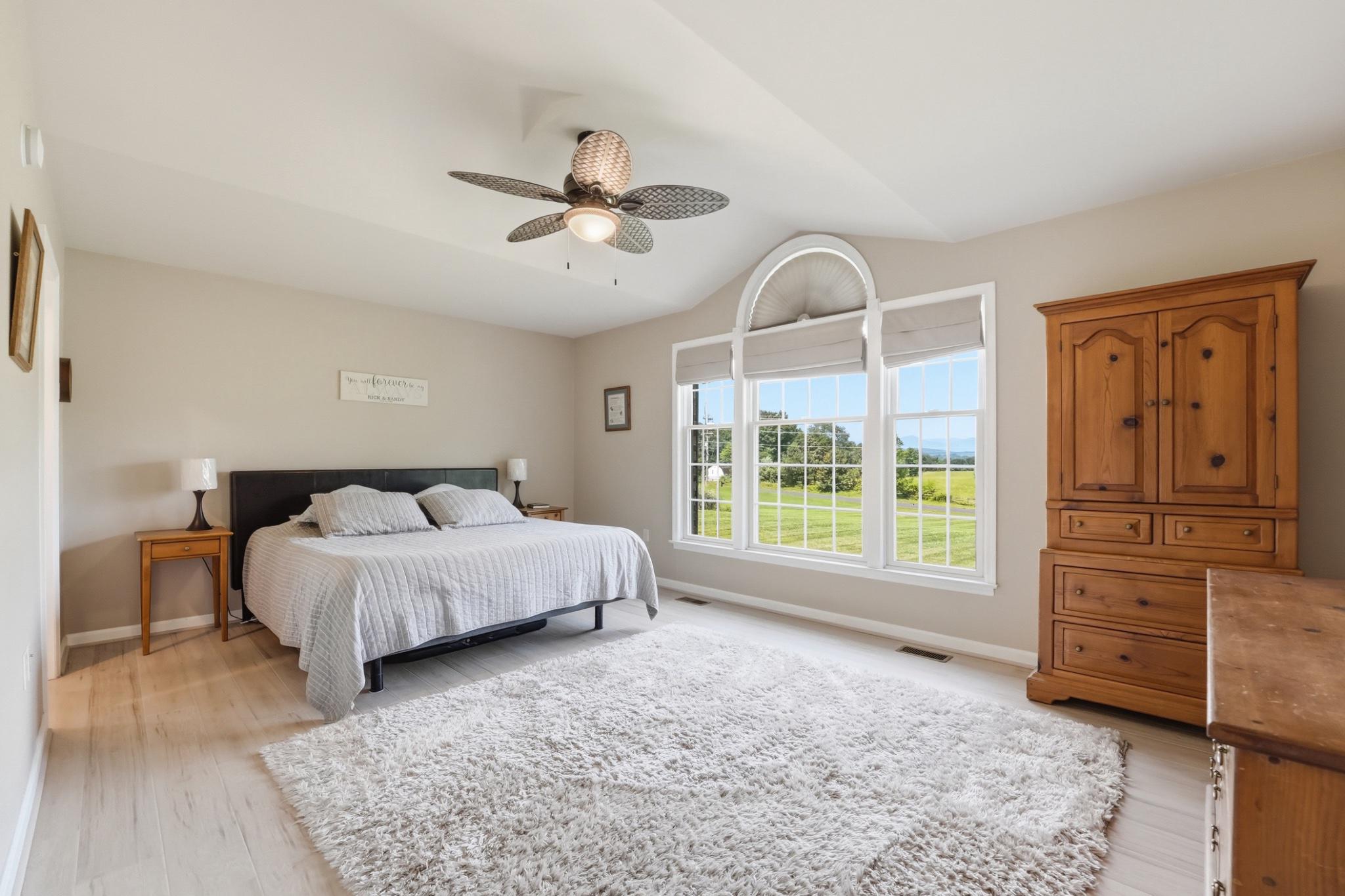 11337 Old Stillhouse Road Boston, VA 22713 - Photo 34 of 58 a bed sitting in a spacious bedroom next to a window