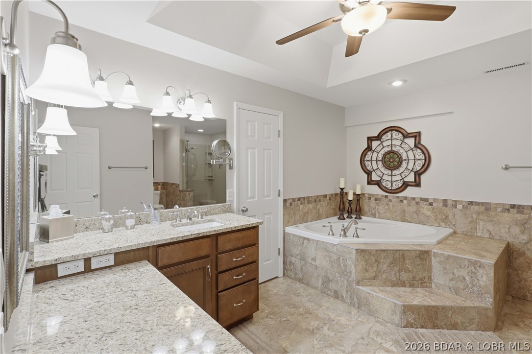 231 Ridgewood Drive Lake Ozark, MO 65049 - Photo 18 of 56 Primary ensuite with 2 walk in closets