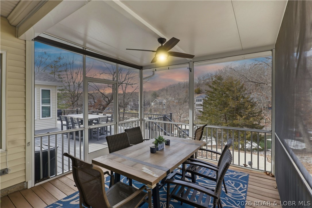 231 Ridgewood Drive Lake Ozark, MO 65049 - Photo 41 of 56 Screened in dining with a TV